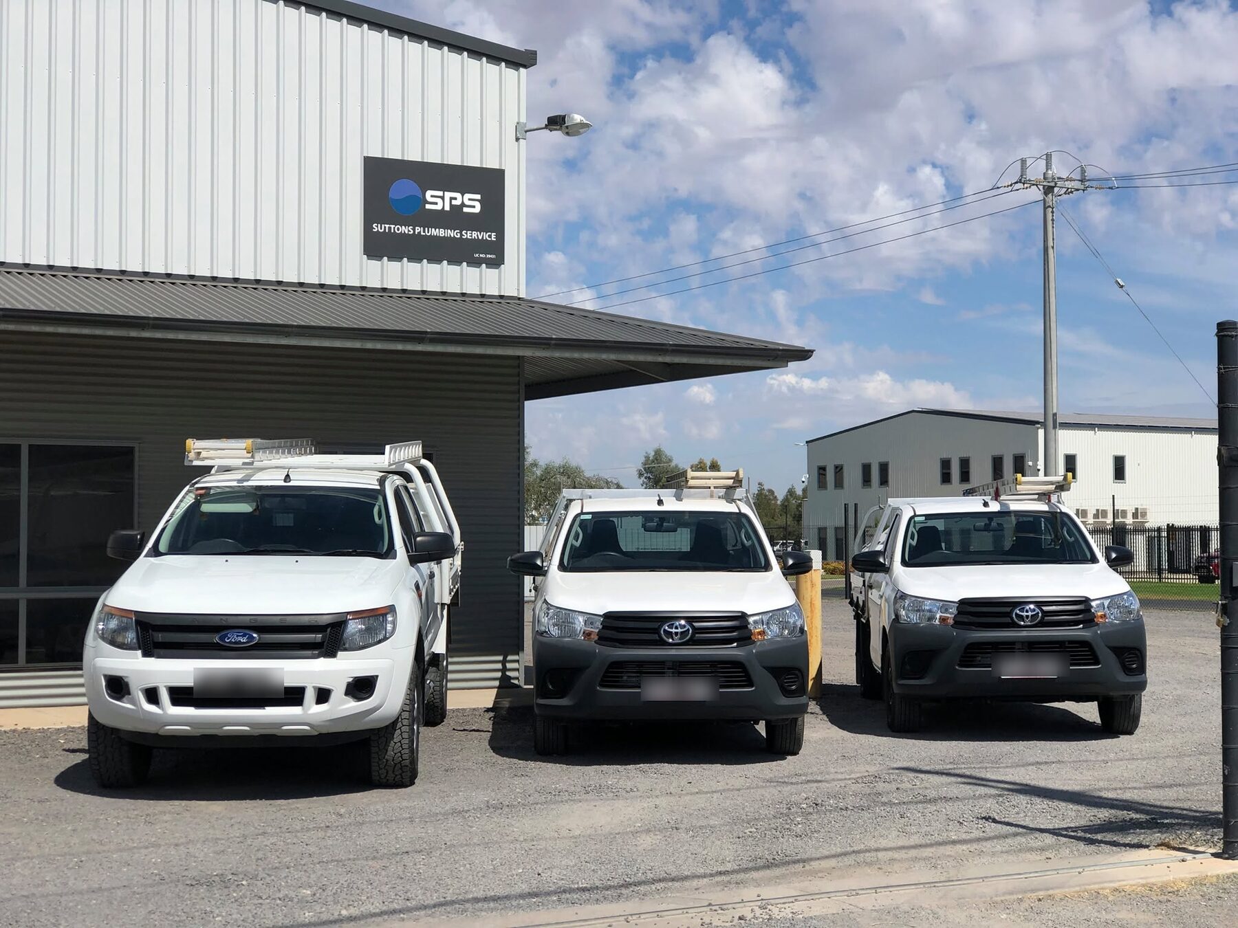 SPS Plumbing service vehicles at the Suttons Plumbing Service depot, Swan Hill
